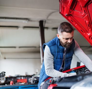 man-mechanic-repairing-a-car-in-a-garage-.jpg